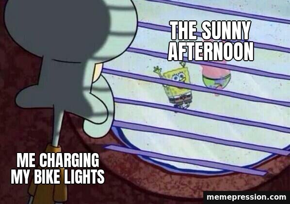 Squidward Window meme: Me charging my bike lights / The sunny afternoon